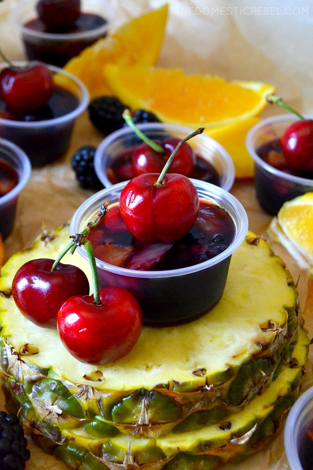 sangria jello shot on top of slices of pineapple