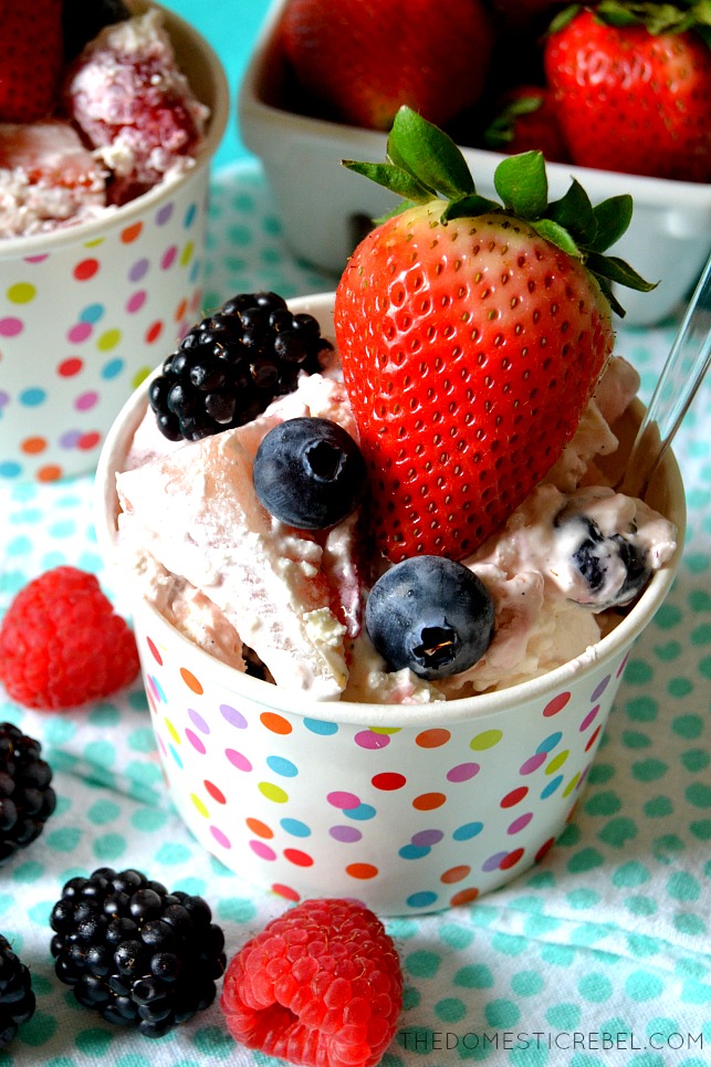 aerial view of berry cheesecake fluff in a bowl with blueberries, strawberries and blackberries