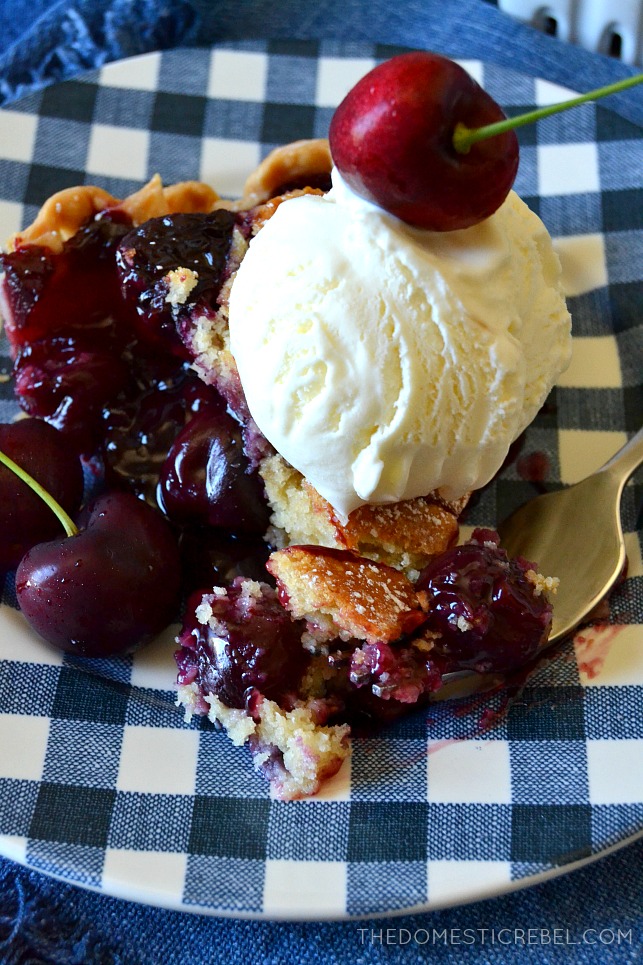 slice of cherry cobbler pie next to a fork 
