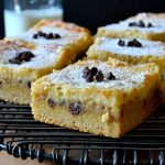 These Chocolate Chip Cookie Dough Gooey Bars are fantastic! Magical layers of a soft and chewy cake base with a layer of gooey, brown sugary, chocolate-studded cookie dough, topped with a luscious cream cheese layer, they're baked to perfection and so indulgent!