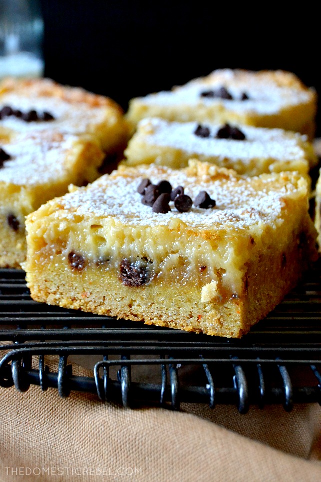 side view of a chocolate chip cookie dough gooey bar on a cooling rack 