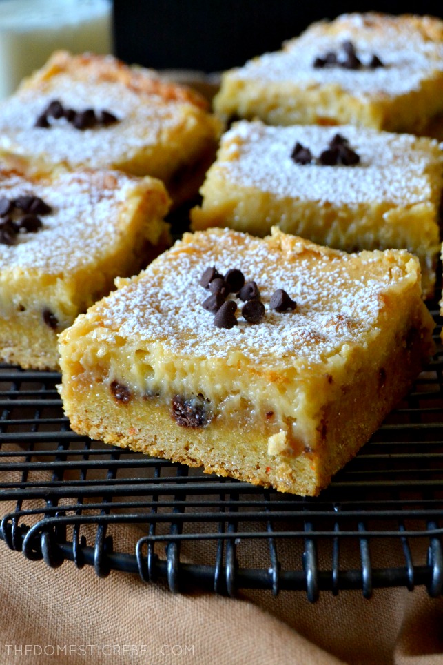 chocolate chip cookie gooey bars in rows on a wire cooling rack 