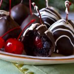 These OREO TRUFFLE CHERRIES are a fun twist on a classic Oreo truffle! Rich, no-bake, EASY Oreo truffles wrapped around a juicy maraschino cherry and then enrobed in sweet milk chocolate. Decorate or drizzle however you'd like! Quick, simple, no-bake treat for the holidays!