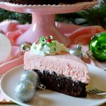 This Peppermint Brownie Cheesecake is such an impressive, show-stopping, EASY dessert for the holidays! Cool, creamy, minty no-bake peppermint cheesecake sits atop a fudgy baked brownie in this decadent and beautiful dessert! Can be made ahead and feeds a crowd!