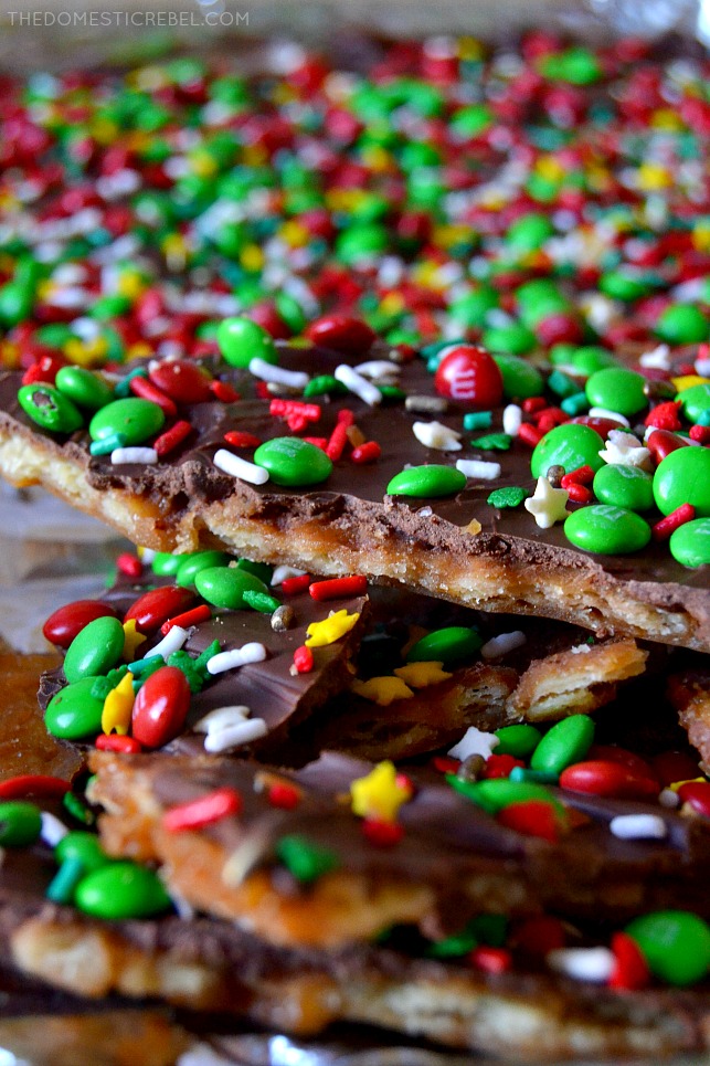 Christmas Cracker Toffee is buttery, chocolaty, gooey, crispy toffee made with salted crackers, a golden toffee mixture, chocolate, and seasonal candies! Super simple, comes together in minutes and is so addictive and irresistible, some people call it Christmas Crack! 