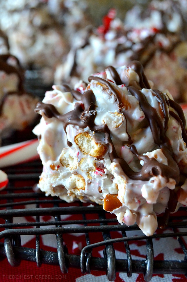 Close-up of a piece of white chocolate peppermint bark pretzel candy split to show the texture inside