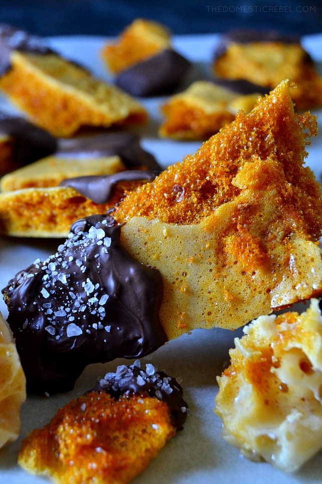 Close-up of a piece of honeycomb sponge candy dipped in chocolate and topped with sea salt