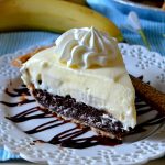 This Brownie Bottom Banana Cream Pie is super unique and totally delicious! A flaky, buttery pie crust is filled with a fudgy, gooey brownie and topped with fresh bananas and a cool and creamy banana pudding! So easy and divine!