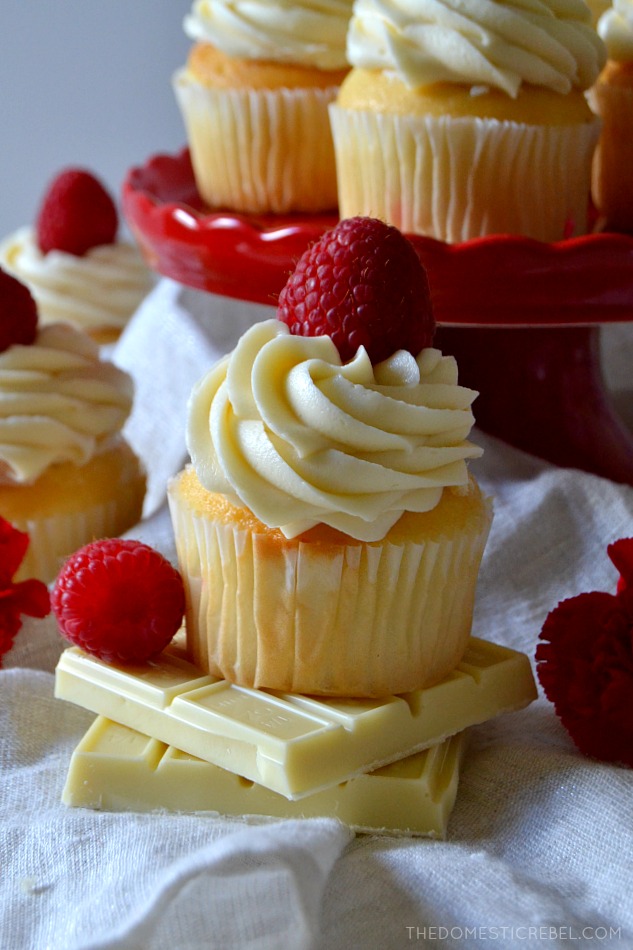 These White Chocolate Raspberry Cupcakes are moist, tender vanilla cupcakes filled with a tart and tangy raspberry jam and topped with a silky mountain of white chocolate buttercream! Sweet, creamy, soft and delicious! 