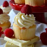 These White Chocolate Raspberry Cupcakes are moist, tender vanilla cupcakes filled with a tart and tangy raspberry jam and topped with a silky mountain of white chocolate buttercream! Sweet, creamy, soft and delicious!