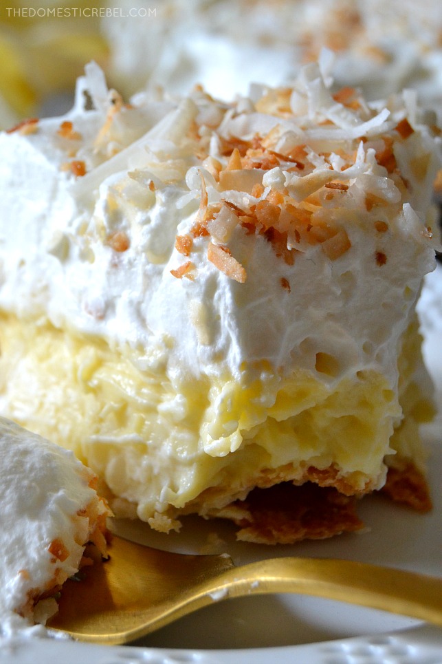 This is the BEST recipe for Homemade Coconut Cream Pie! Silky, decadent, creamy coconut custard in a flaky, buttery pie crust and topped with fresh sweetened whipped cream and toasted nutty coconut. So easy, delectable and makes for an amazing party dessert! 