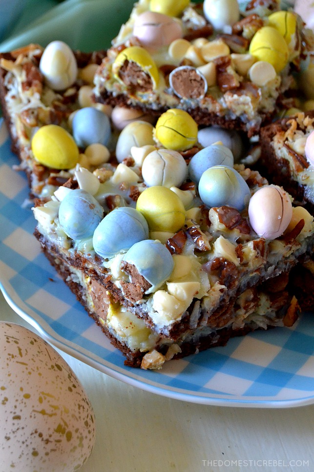 These Cadbury Egg Magic Bars are crunchy, creamy, chewy and gooey with coconut, pecans, white chocolate and Cadbury mini eggs on a fudge brownie crust! Super easy, comes together quickly and they're so perfect for Easter and springtime celebrations!