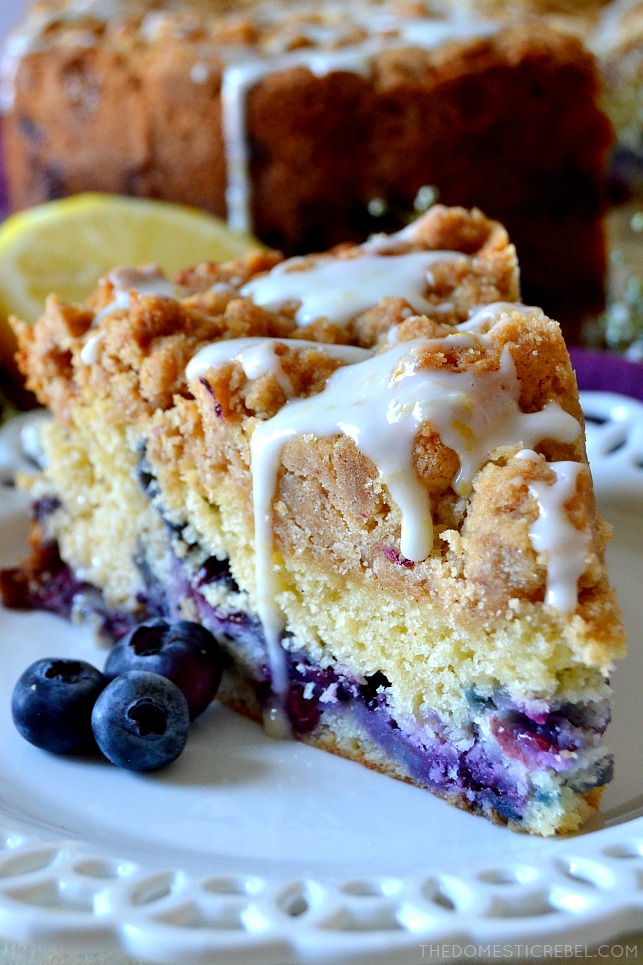 This Blueberry Muffin Crumb Cake is easy, impressive and perfect for brunch or dessert! Moist and soft cake filled with juicy blueberries and topped with a mountain of thick brown sugar crumb with a lemon glaze. So delicious! 