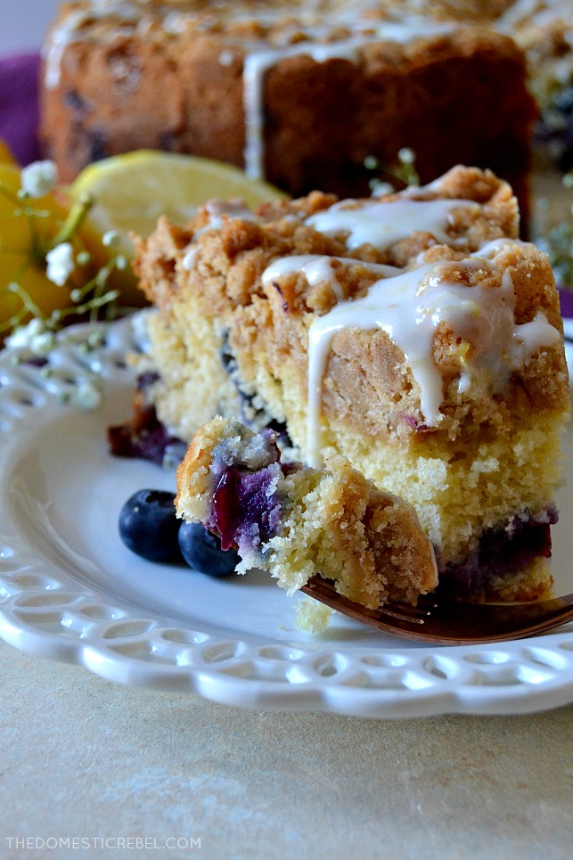 This Blueberry Muffin Crumb Cake is easy, impressive and perfect for brunch or dessert! Moist and soft cake filled with juicy blueberries and topped with a mountain of thick brown sugar crumb with a lemon glaze. So delicious! 