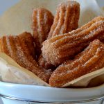 These Perfect & Easy Homemade Churros are light and crispy with soft, fluffy interiors and an amazing cinnamon sugar flavor! You won't believe how simple these are to make, too! Perfect for Mexican food night, Cinco de Mayo or parties!