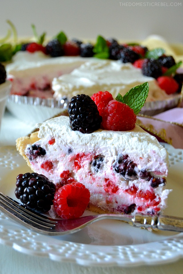 This No-Bake Berry Mousse Pie is absolutely delicious and simple, too! Light, fluffy and sweet berry and zesty lemon mousse filling in a buttery shortbread crust and topped with fresh whipped cream! You'll love this dreamy, no-bake pie! 