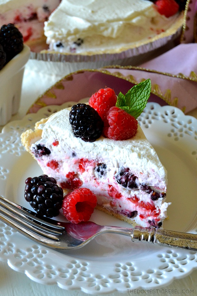 This No-Bake Berry Mousse Pie is absolutely delicious and simple, too! Light, fluffy and sweet berry and zesty lemon mousse filling in a buttery shortbread crust and topped with fresh whipped cream! You'll love this dreamy, no-bake pie! 