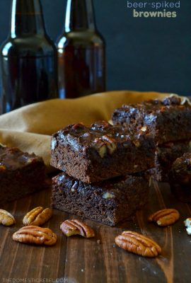 These Beer-Spiked Brownies with Poured Pecan Frosting are to-die for! Rich and fudgy, these chocolaty brownies have a hint of brown ale in every bite with an addictive, melt in your mouth sheetcake-style frosting on top! You will love this recipe!