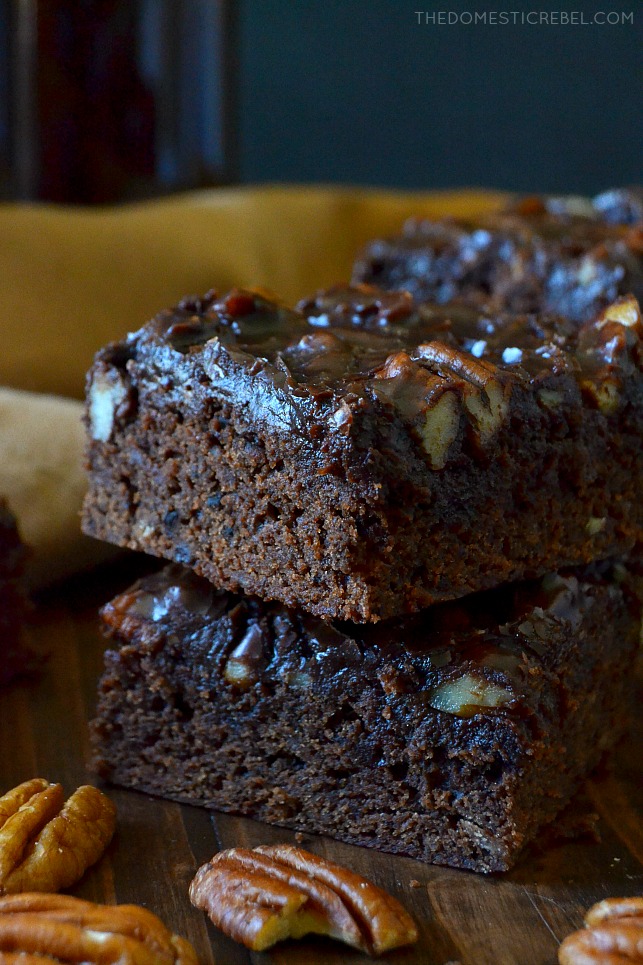These Beer-Spiked Brownies with Poured Pecan Frosting are to-die for! Rich and fudgy, these chocolaty brownies have a hint of brown ale in every bite with an addictive, melt in your mouth sheetcake-style frosting on top! You will love this recipe! 
