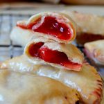 These Air Fryer Cherry Hand Pies are addictive, irresistible, two-bite hand pies filled with juicy cherry pie filling (or any flavor you like!). Made in the air fryer (with a regular oven direction too!), they're crisp and tender and SO easy! You do not want to miss this recipe!