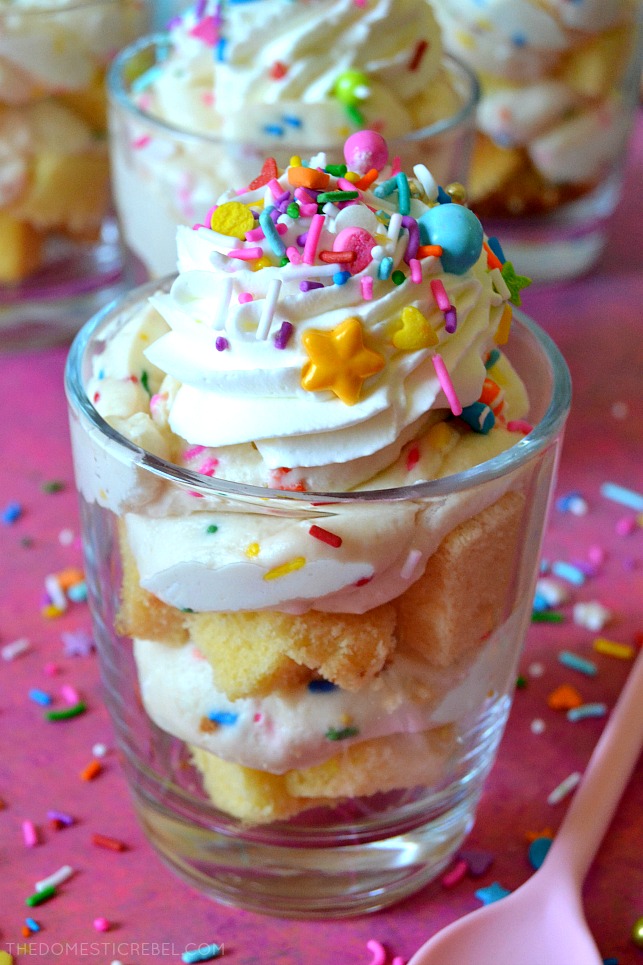 These NO-BAKE BIRTHDAY CAKE PARFAITS are irresistible, easy and SO delicious! Layers of moist cake crumbs and sinfully sweet birthday cake mousse comes together super fast and is great for satisfying your cake craving without even turning on the oven!! 