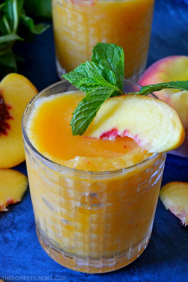 These 2-Ingredient Peach Moscato Slushies are going to be a HIT for your next get-together! Made in SECONDS, they are just TWO ingredients: frozen fruit and wine - for an irresistible, icy cool, refreshing and TASTY slushie beverage! 
