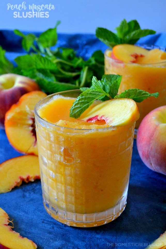 These 2-Ingredient Peach Moscato Slushies are going to be a HIT for your next get-together! Made in SECONDS, they are just TWO ingredients: frozen fruit and wine - for an irresistible, icy cool, refreshing and TASTY slushie beverage! 