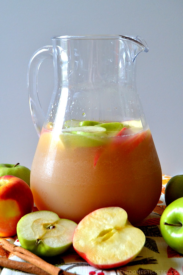 This Apple Cider Sangria is going to be a huge HIT at your next gathering! Sweet, crisp, refreshing and cinnamon-y spiked sangria made with fresh and sparkling apple cider!