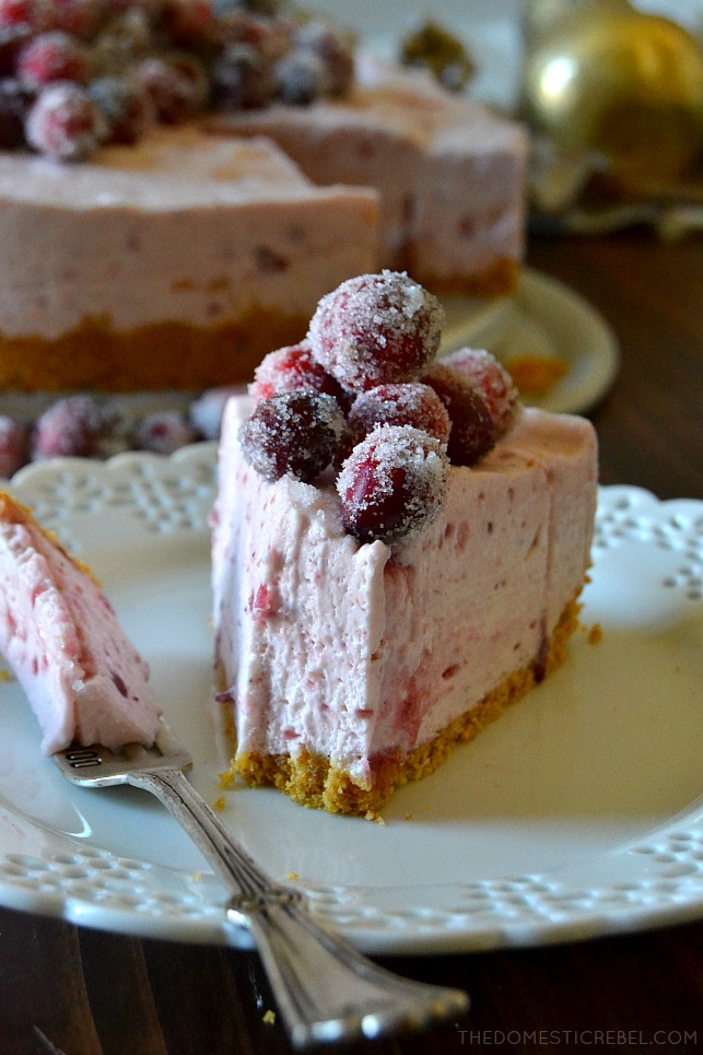 This No-Bake Cranberry Cheesecake is for serious cranberry lovers! Sweet, light and fluffy, it's made with whole berry cranberry sauce for a tasty, tart and tangy cheesecake topped with beautiful sugared cranberries! 