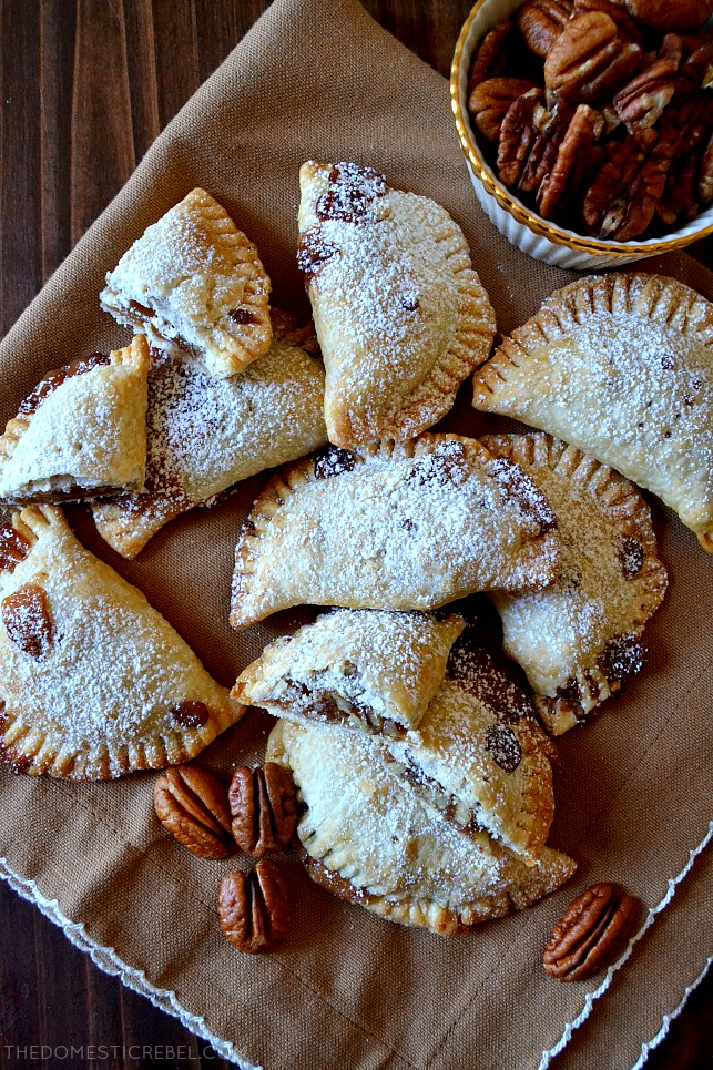 These Air-Fryer Pecan Hand Pies are absolutely irresistible and so easy! Made in either the air-fryer or the oven, these two-bite pies are buttery, flaky and filled with DELICIOUS gooey pecan pie filling! Such a great shortcut for the busy holiday seasons! 
