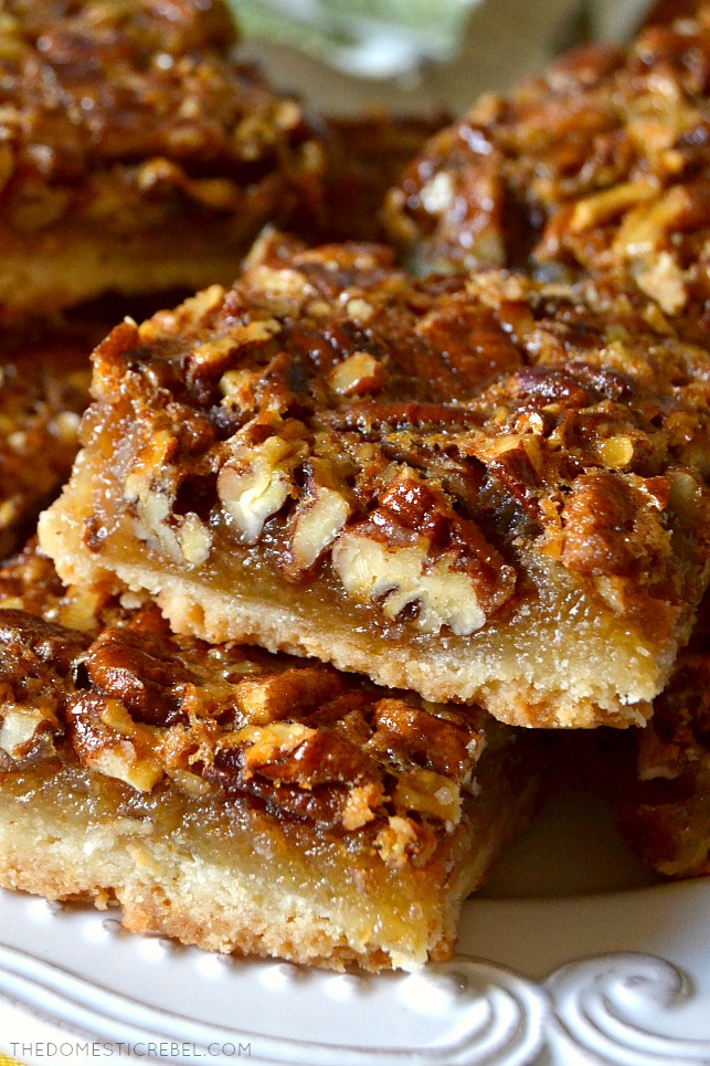 These Super Easy Pecan Pie Bars are going to be your go-to recipe from now on! Perfectly portioned and portable, these chewy and gooey bars have a buttery shortbread crust and the most incredible pecan pie filling! 