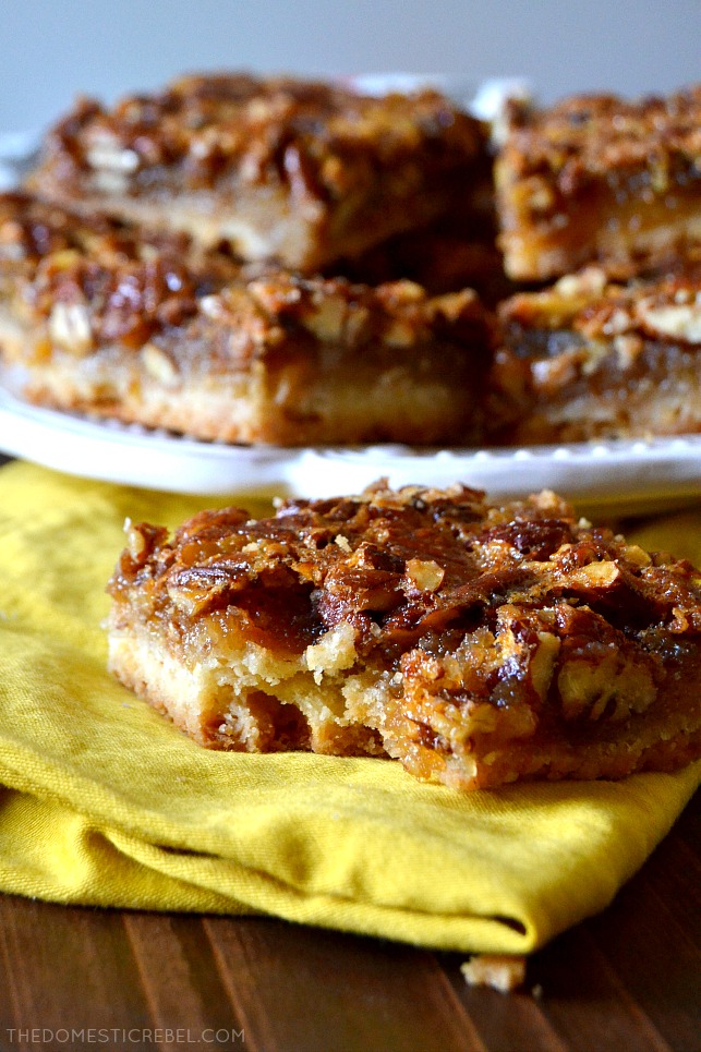 These Super Easy Pecan Pie Bars are going to be your go-to recipe from now on! Perfectly portioned and portable, these chewy and gooey bars have a buttery shortbread crust and the most incredible pecan pie filling! 
