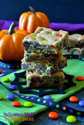 These Halloween M&M Cookie Bars are like deep dish chocolate chip cookies! Soft, chewy, buttery and chocolaty with festive Halloween M&M's candies and lots of flavor! Great for feeding a crowd!