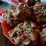 This Christmas Crockpot Candy is a must-make for the holidays! Creamy, crunchy, sweet and salty clusters of chocolate and peanuts make this easy slow-cooker candy a family favorite!