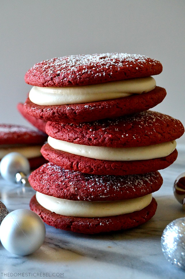 trio of red velvet whoopie pies stacked on marble with silver ball ornaments