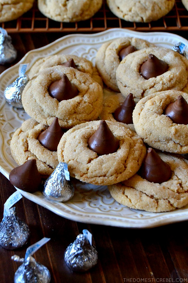 peanut butter blossoms on white plate with hershey kisses