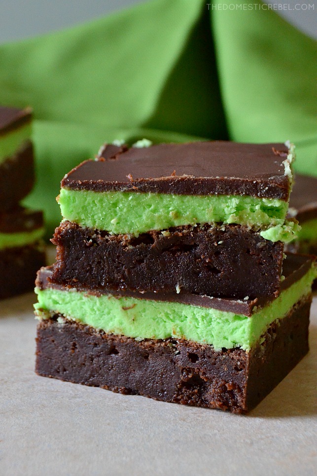 small stack of mint chocolate brownies with green fabric