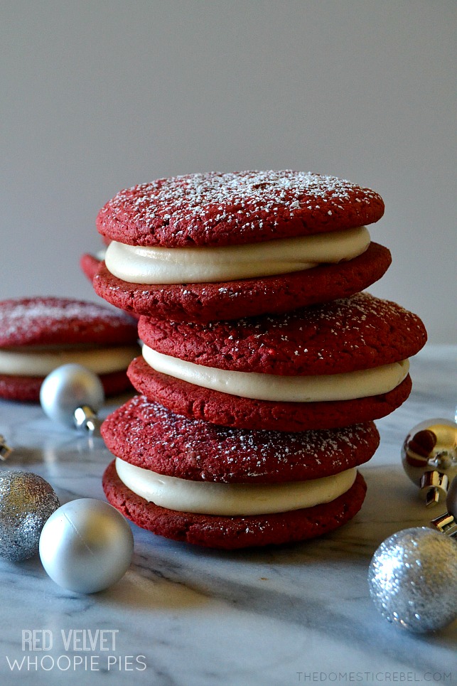 red velvet whoopie pies stacked on marble with ornaments