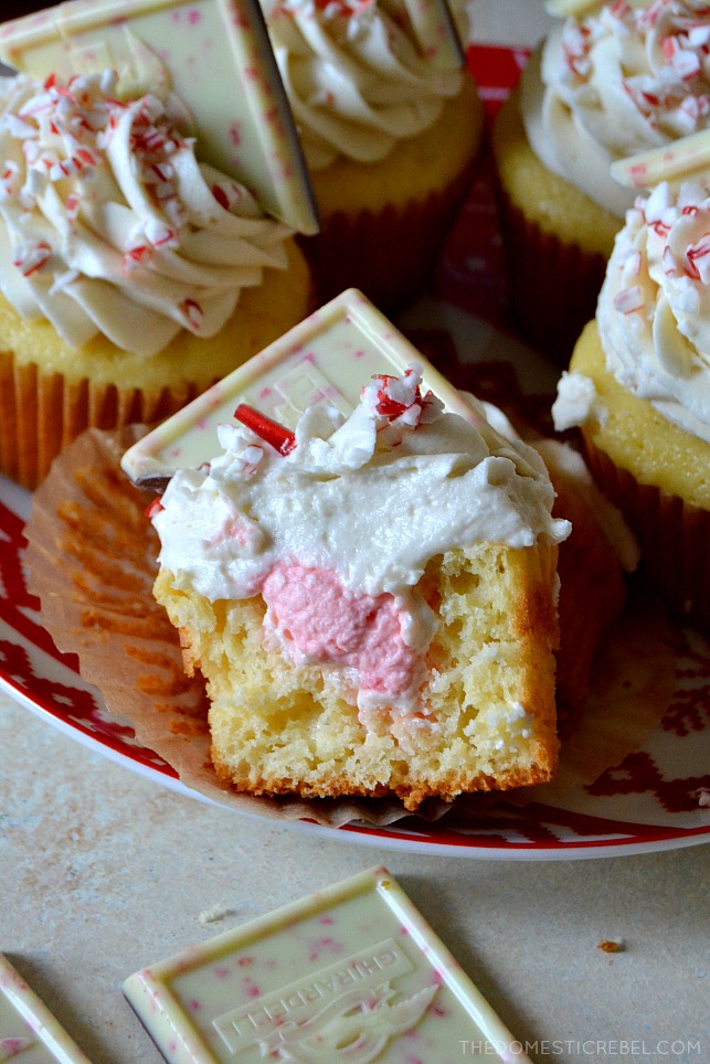 white chocolate peppermint cupcake cut in half on red and white plate