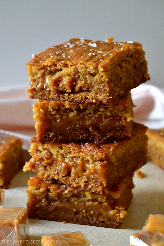 These Salted Caramel Blondies are addictive, sweet and salty and so simple! Soft and chewy with a gooey caramel filling, they're finished with an irresistible flaky sea salt crunch.