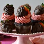 These Chocolate-Covered Strawberry Cupcakes are easy, beautiful and super tasty with a moist chocolate cupcake base, a real strawberry buttercream and a fresh chocolate-covered strawberry on top!