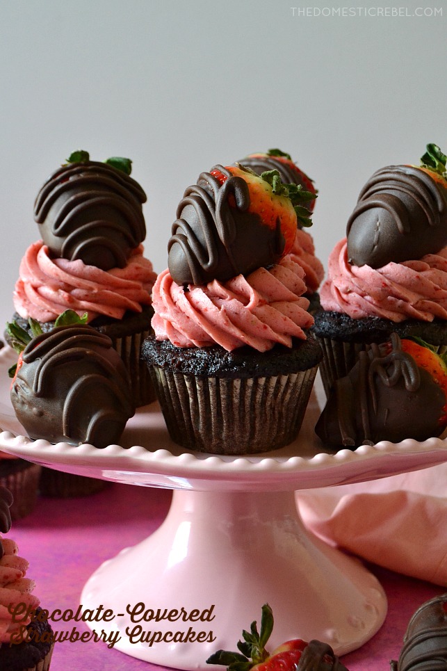 chocolate covered strawberry cupcakes on pink cake stand