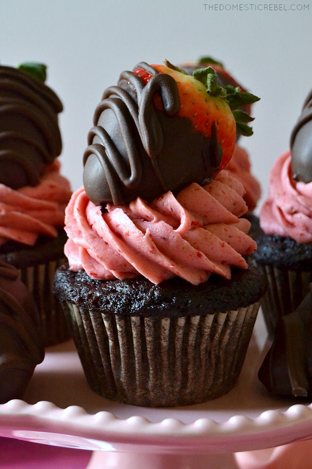 These Chocolate-Covered Strawberry Cupcakes are easy, beautiful and super tasty with a moist chocolate cupcake base, a real strawberry buttercream and a fresh chocolate-covered strawberry on top! 