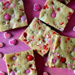 These Valentine's M&M Cookie Bars are deep-dish style, thick, soft and chewy chocolate chip cookie bars studded with Valentine's themed M&M's for ultra delicious, crowd-pleasing cookie bars!