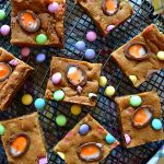 These Cadbury Easter Egg Cookie Bars are soft and chewy chocolate chip cookie bars fully loaded with pastel M&M's and Cadbury creme eggs for a delightful Easter treat!