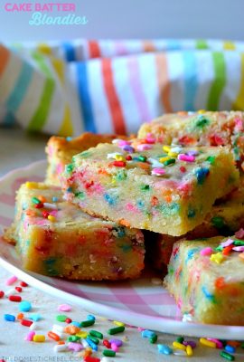 cake batter blondies stacked on a pink gingham plate