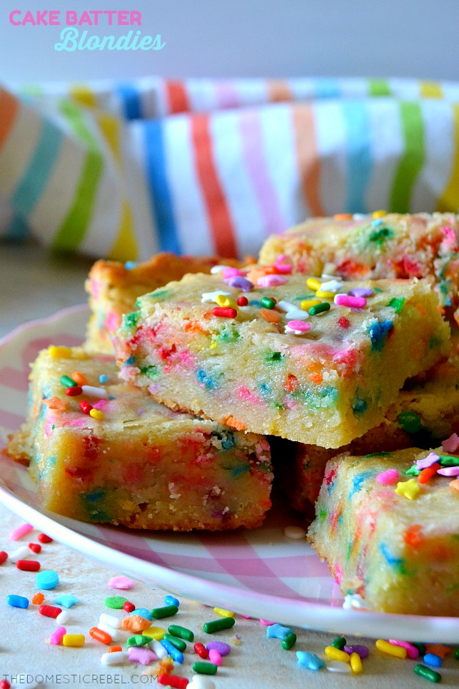 cake batter blondies on pink plate with rainbow fabric