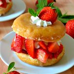 Doughnut Strawberry Shortcake is a fun and unexpected twist on a classic no-bake dessert, combining glazed yeast doughnuts with fresh whipped cream and juicy strawberries. Easy, impressive, fast and so delicious!