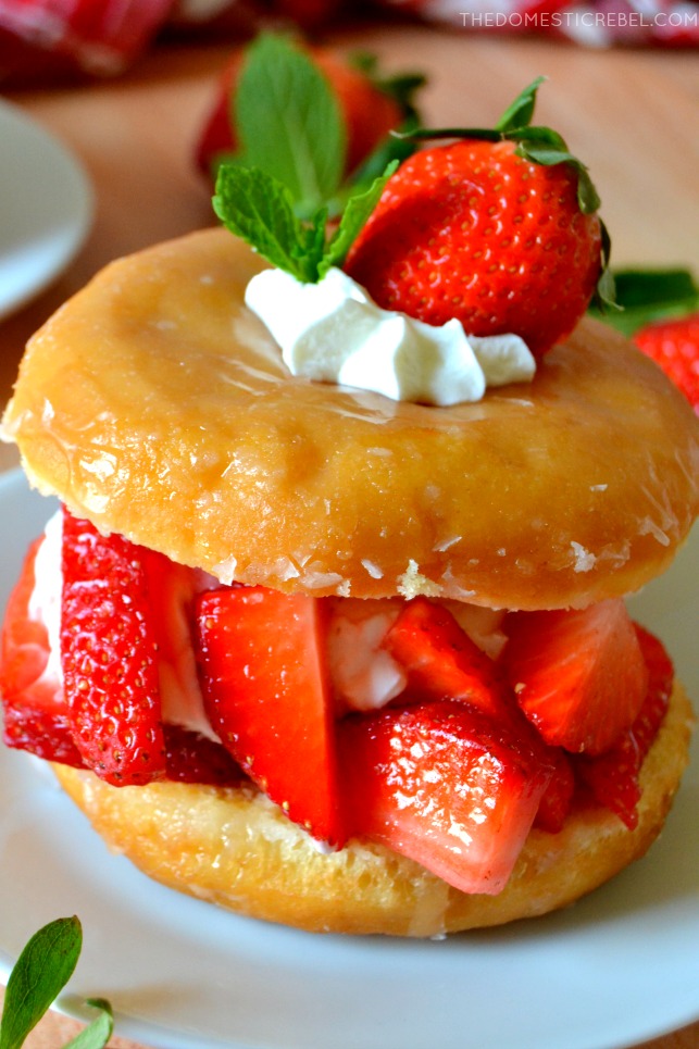 closeup of doughnut strawberry shortcake on white plate