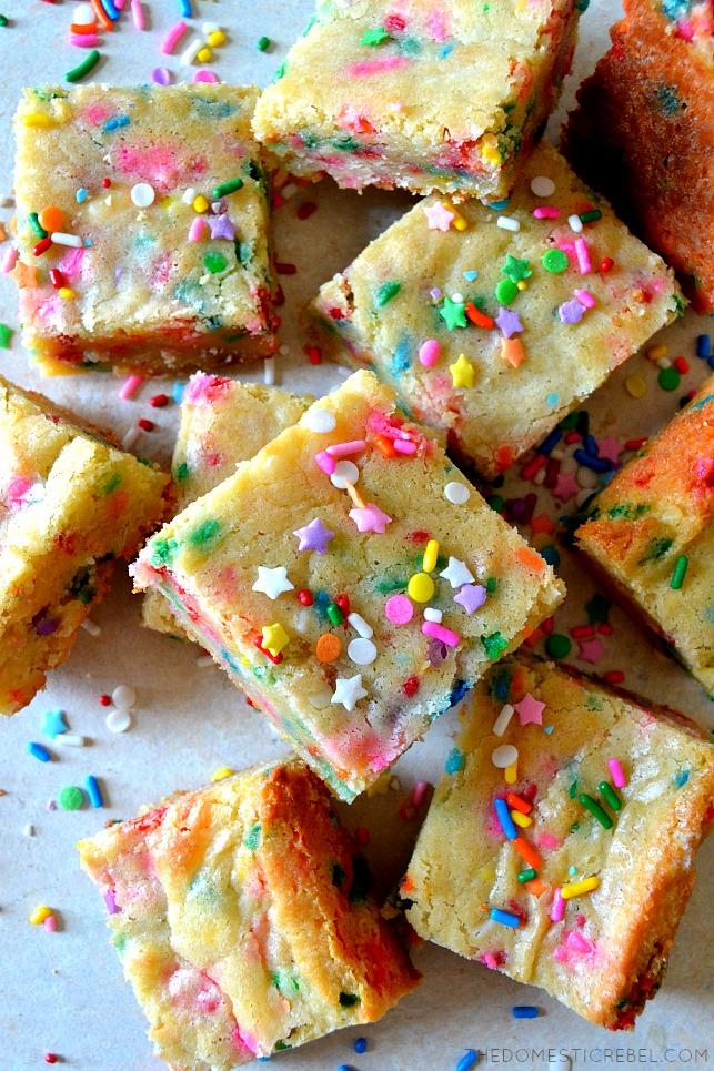 a scattered pile of cake batter blondies on wood